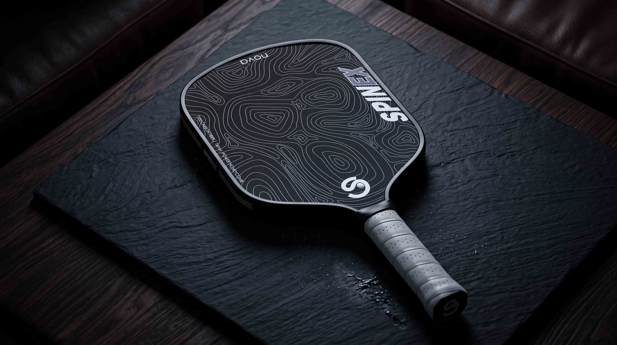 Spinex NOVA Outback Black pickleball paddle on an outdoor court